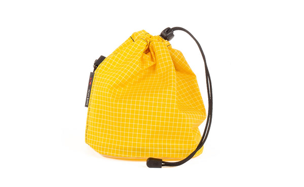 A Medium, clear-bottomed Yarn Stuff Sack in Solaris (yellow with white grid) 200 Halcyon.
